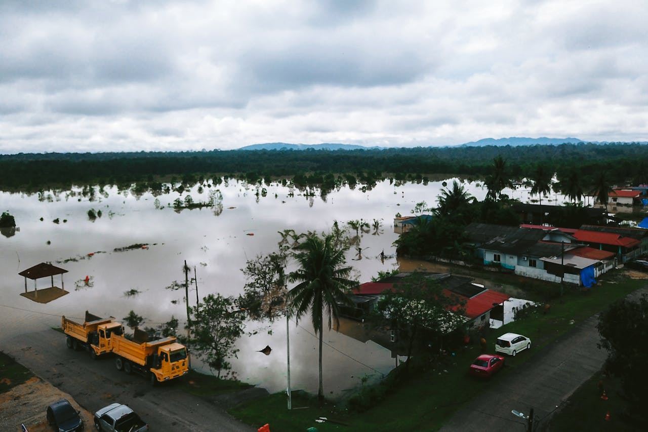 why-choose-us Aerial view of a flooding landscape in Kijal, Terengganu, Malaysia, illustrating the impact of natural disasters.